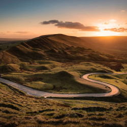 Sunset over a winding countryside road in Castleton